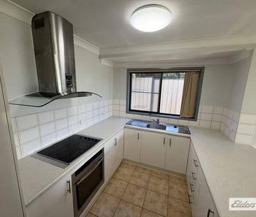 **Coming Soon - 2 Bedroom Brick Duplex** - Photo 2