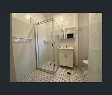 -Centrally located large two bedroom unit with sun room. - Photo 5