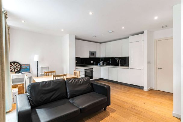 Bright two double bedroom flat with wooden floors and high standard fixtures in an extremely popular small new development on a side street near King's Cross. - Photo 1