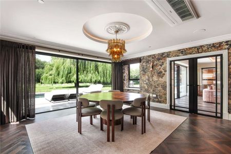 An immaculately curated village home set in gardens with a pool and detached gym - Photo 3