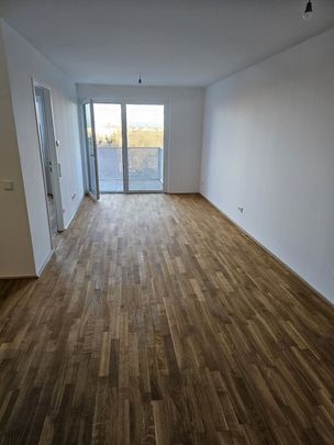 Neubau-Erstbezug mit Balkon, Fernblick & Top-Anbindung in Simmering - Photo 1