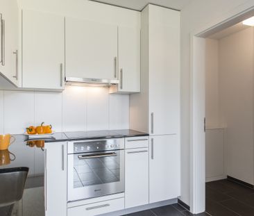 Grün trifft Behaglichkeit - Ihre Erdgeschosswohnung mit Gartensitzp... - Foto 1