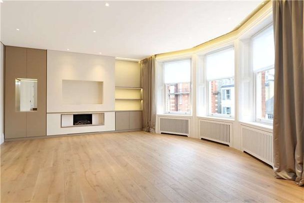 A superb 4 bedroom apartment on the 3rd floor of a popular Kensington Mansion block. - Photo 1