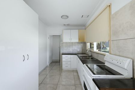 CENTRAL LOCATION- FULLY FENCED HOME - Photo 5