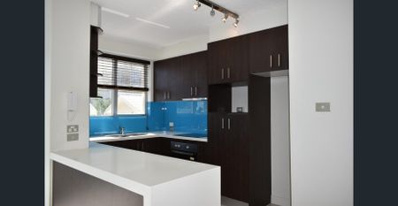 Third Floor Unit with Lift - Ideal Location - Photo 5