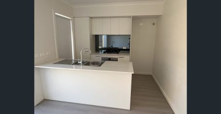 Three Bedroom Home with Modern Design and Low Maintenance - Photo 3