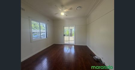 Spacious 3-Bedroom Home with Sunroom & Backyard! - Photo 2