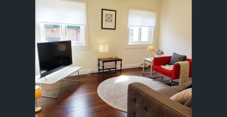 Spacious 4-Bedroom Family Home with Large Backyard Prime Location! - Photo 2