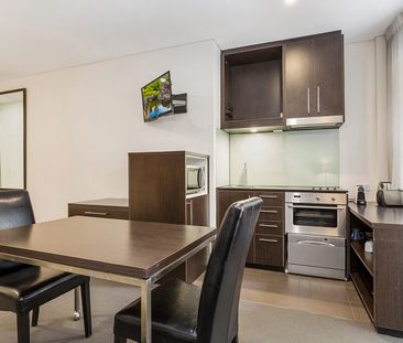 Fully Furnished Apartment in the Heart of the City - Photo 1