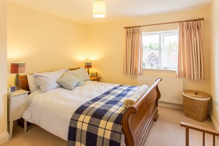 A modern detached family home, offering spacious and flexible living in a pretty village location. - Photo 4