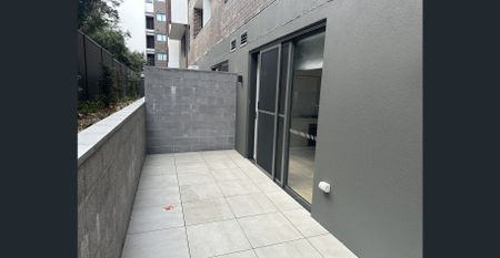 Near new, split level, spacious two bedroom, two bathroom apartment in quiet location only metres from Homebush Train Station - Photo 4
