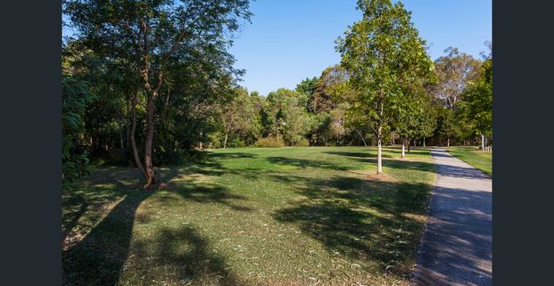 Expansive Family Home with Multiple Living Areas and Parkland Views - Photo 1