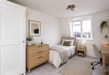 An impressive top-floor two bedroom apartment combining generous proportions, abundant natural light and outstanding park views in the heart of Primrose Hill. - Photo 3