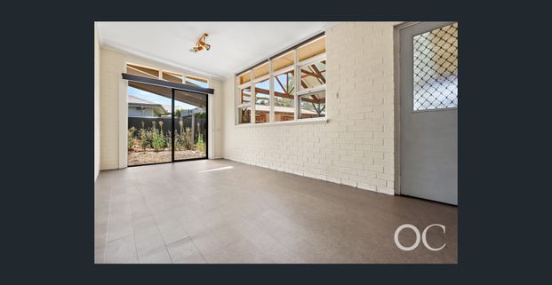 Open the door to easy living by the coast - Photo 1