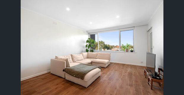 Top-Floor Luxury with Sweeping Views in a Prime Lifestyle Location - Photo 1