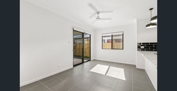 BRAND NEW SPACIOUS AND MODERN 4 BEDROOM HOME AVAILABLE NOW! - Photo 1