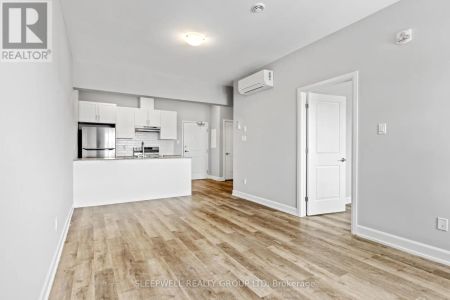 302 - 979 NORTH RUSSELL ROAD - Photo 2