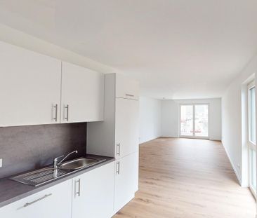 2-Zimmer-Neubauwohnung mit besonderem Schnitt! EBK und Balkon/Terra... - Foto 1