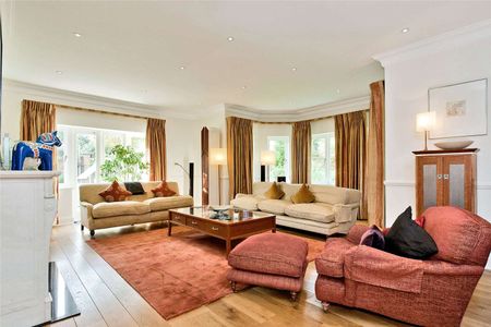 Situated in grounds of just over half an acre and located in one of Esher's most sought after private roads close to High Street. - Photo 2