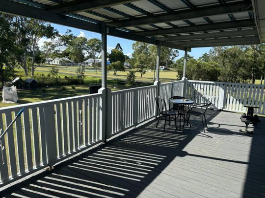 ELEVATED HOME ON LARGE BLOCK - FURNISHED PROPERTY WITH MOWING INCLUDED - Photo 1