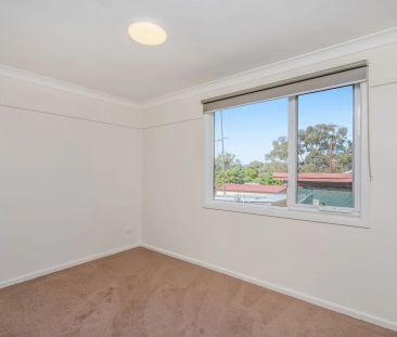 Updated 3 Bedroom Cottage in Prime Location - Photo 2