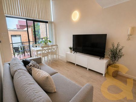 Stylish Loft Apartment in Boutique Security Building - Photo 5