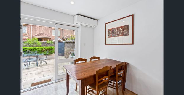 Bright and Spacious Townhouse with Private Courtyard & Double Garage - Photo 1