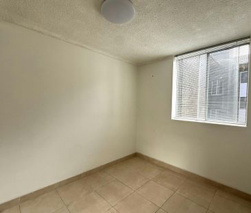 ELEVATED UNIT IN A CENTRAL LOCATION - Photo 2