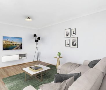 Comfortable Easy-Care Living I Top Floor Apartment - Photo 1