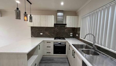 Modern and Convenient Three Bedroom Home! - Photo 3