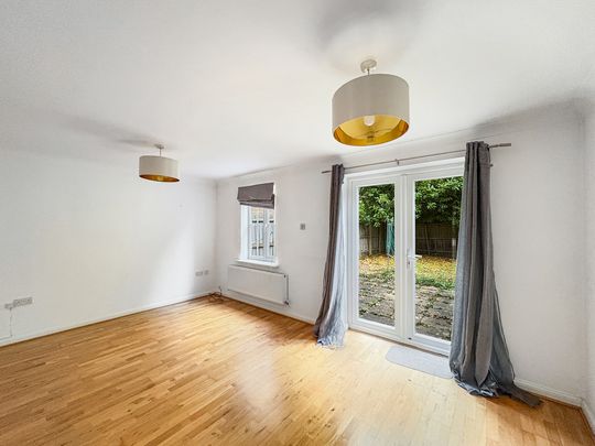 A mid terraced, three bedroom house, with garage and off road parking approximately four miles from Cambridge City Centre, Addenbrookes and the Train Station. - Photo 1