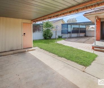 Charming 3-Bedroom Home with Modern Comforts & Outdoor Storage - Photo 2