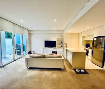 Stylish Apartment Living Surrounded by Waterfront Serenity - Photo 1