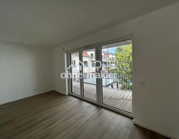 **Neubau** Charmante 2-Zimmer-Wohnung mit Einbauküche und Balkon - Foto 1
