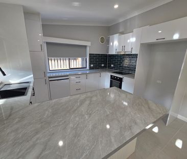 Luxuriously renovated home with landscaped gardens & security system - Photo 3