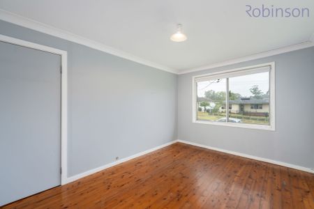 Spacious Family Home with Pool, Double Shed & Ample Parking - Photo 2