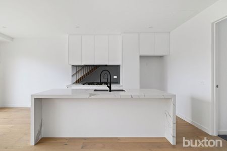 Low-Maintenance Luxury in This Light-Filled Three-Bedroom Townhouse - Photo 3