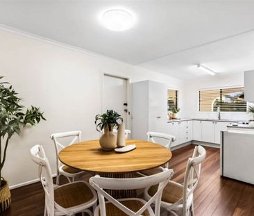 A Bright, Stylish Haven in Prime Petrie Location! - Photo 1