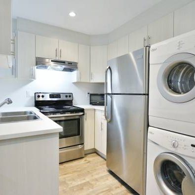 MODERN and very spacious 2 bedroom suite - utilities included! - Photo 1