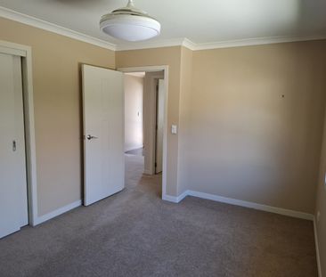 Discover comfort and convenience in this four-bedroom, two-bathroom... - Photo 3