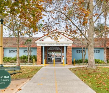 Stylishly updated north-to-rear facing home set on a tree-lined street - Photo 4