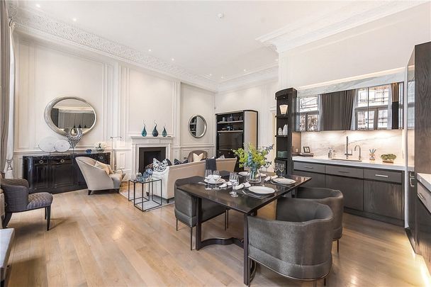 A beautifully presented two bedroom apartment situated on the favoured first floor (wihtout lift) of this impressive period building in the heart of Knightsbridge Village. EPC rating: D - Photo 1
