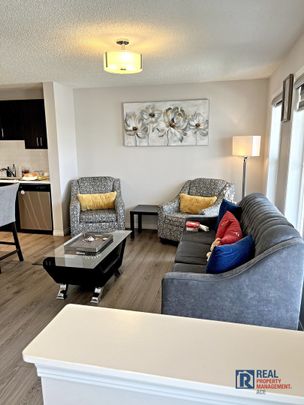 10799 Cityscape Drive NE | Townhouse | 3-bedroom, 2.5-bathroom | Double Garage - Photo 1