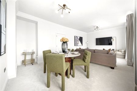 Set on one of the most prestigious addresses in the Royal Borough, this elegant top-floor apartment (with direct lift access) offers two double bedrooms overlooking the garden square, two bathrooms, and a bright rear-facing reception room. EPC rating - Photo 4