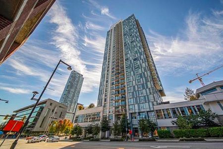 2 Bed Condo | Surrey University District | Parking • Den - Photo 5
