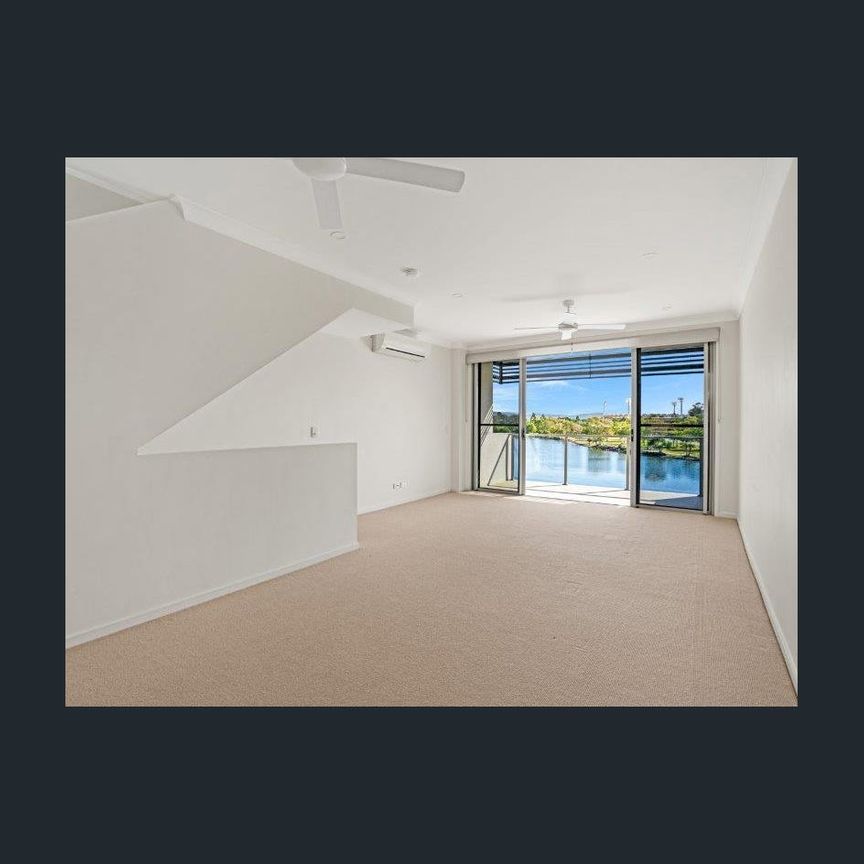 STUNNING WATERFRONT TOWNHOUSE IN EMERALD LAKES - Photo 1