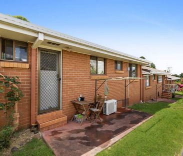 Neat & Tidy Brick Unit in Great Location - Photo 2