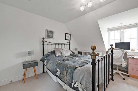 Situated in a peaceful location with open green space to the front, this spacious family home is arranged over three floors and offers well-presented accommodation throughout. - Photo 3