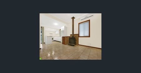 Beautifully Spacious Family Home - Lawn Maintenance Included For Your Convenience! - Photo 3