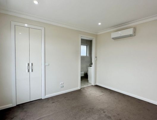 ARCHITECTURALLY DESIGNED TOWNHOUSE IN THE MCKINNON SCHOOL ZONE - Photo 1